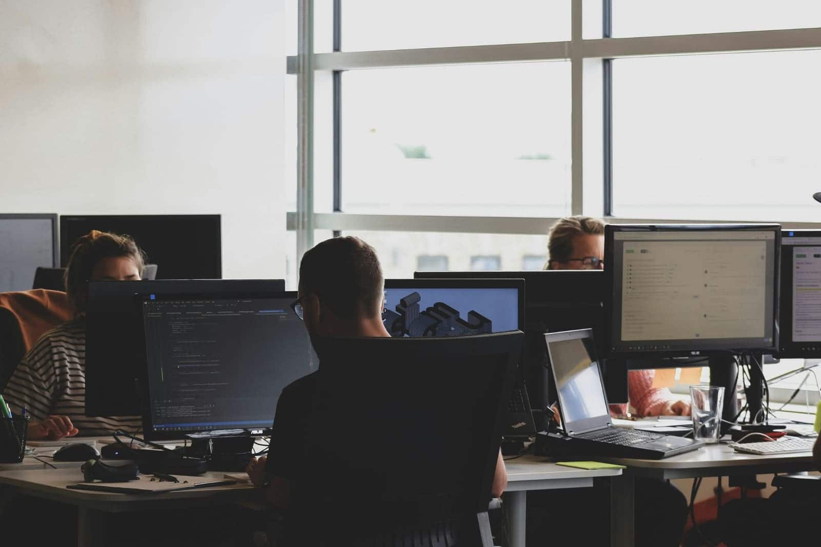 Team working at desks in a bright office